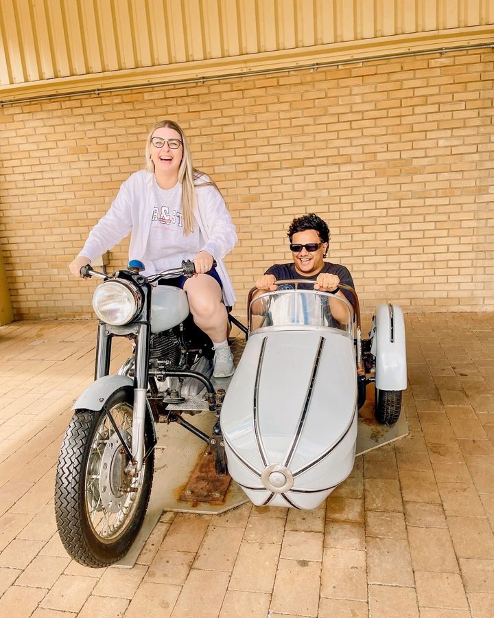 Zoe on a motorbike with Tyler in the sidecar